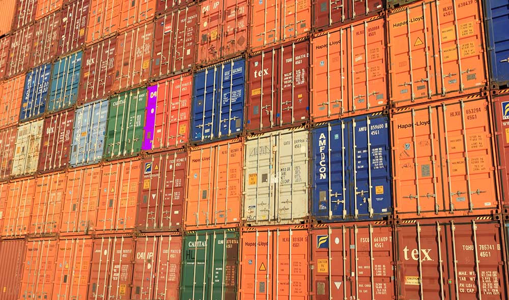 Featured image showing a customs officer inspecting a shipping container, symbolizing the end of the de minimis rule.